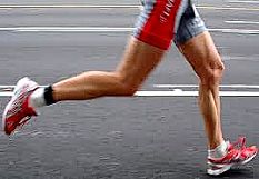 Athlete running on road with a clear 'heel-first' gait