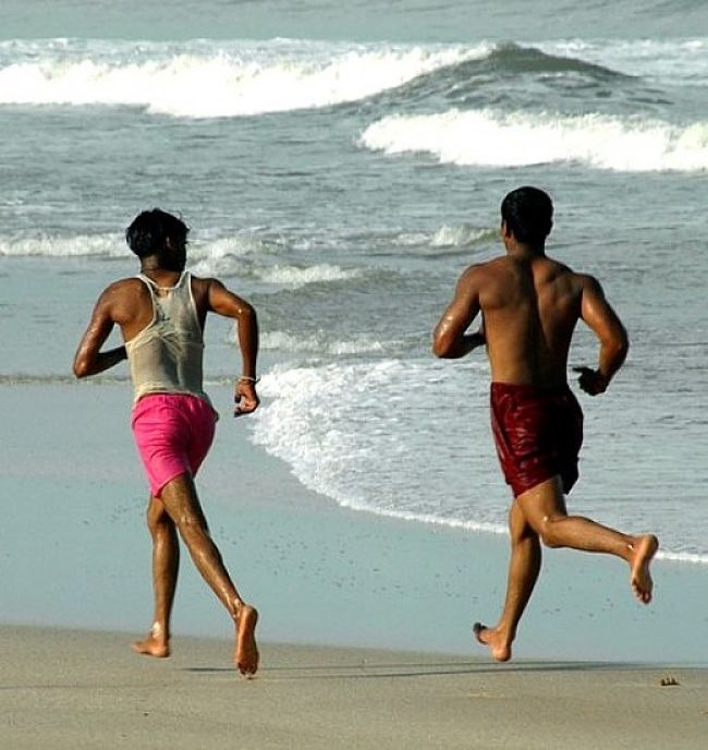 Running on soft sand is probably the softest surface provide you find the area with enough give in it